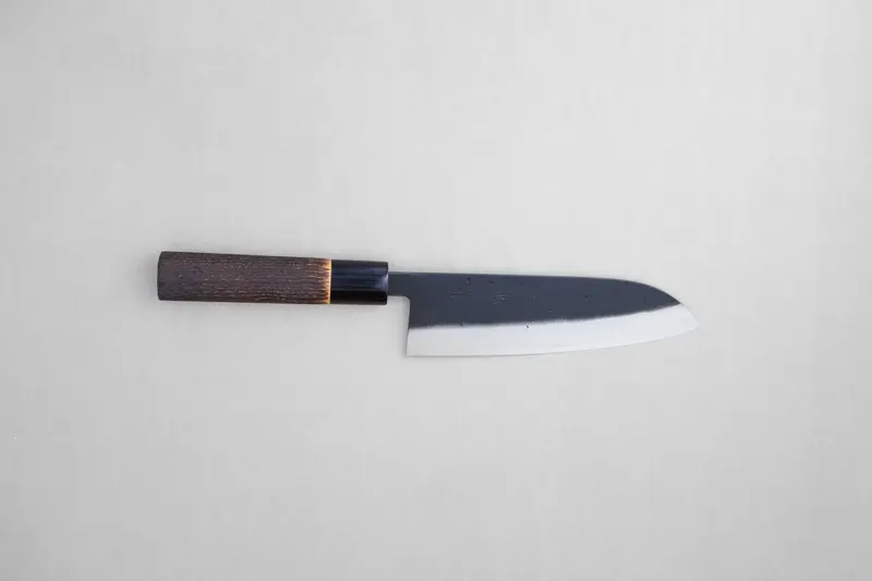 Tadafusa black nashiji SLD santoku with a burned chestnut oval handle and buffalo horn collar 165 mm